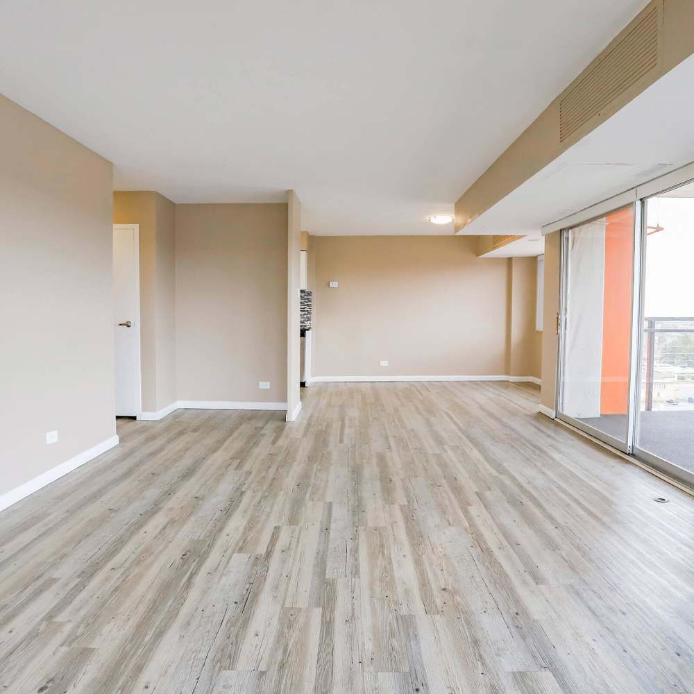 Wood-style flooring for the living room at Wellshire Apartments in Denver,Colorado