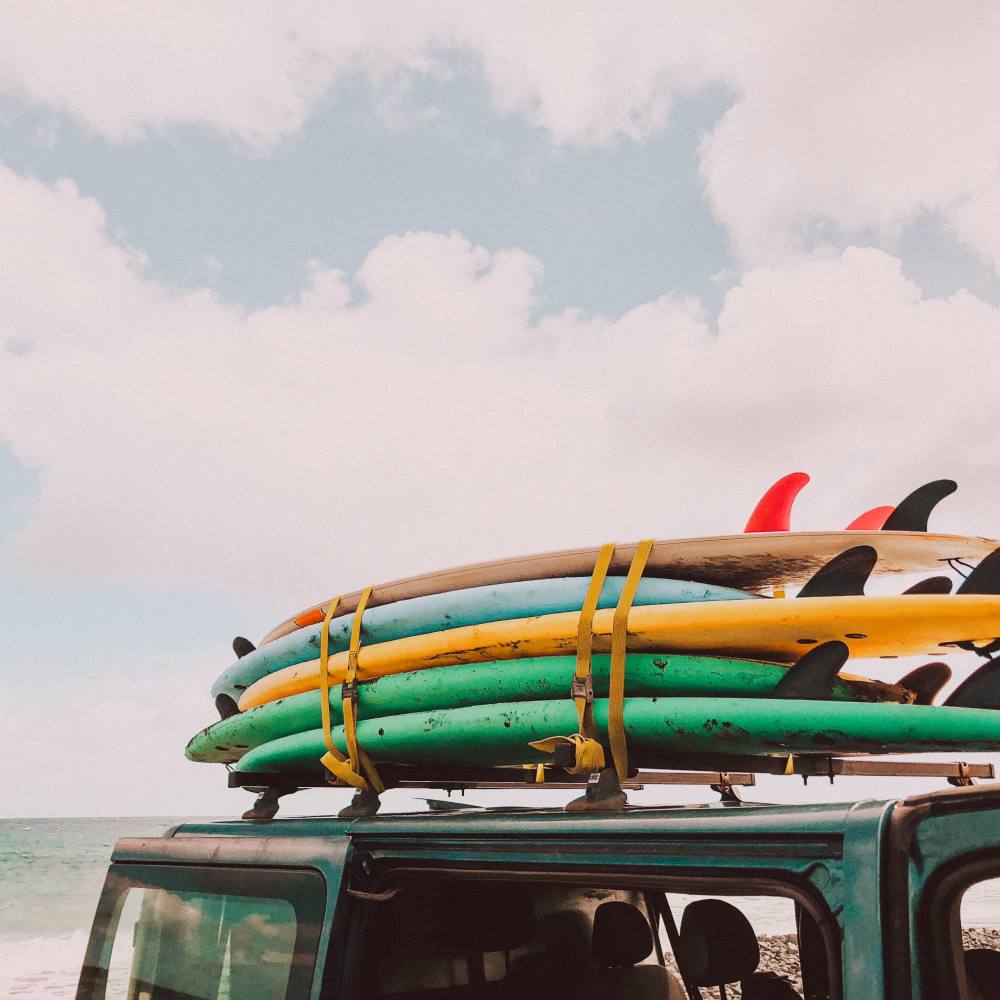 Surfboards on top of a vehicle near Proximity Carolina Beach in Carolina Beach, North Carolina