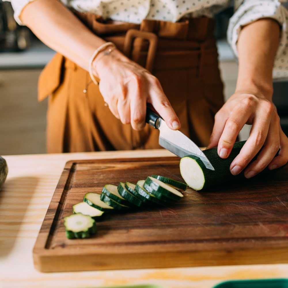 Resident in kitchen at Linwood Apartments in Gainesville, Georgia