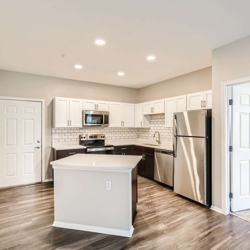 Kitchen with hardwood flooring at Panorama at Arvada Ridge in Arvada, Colorado