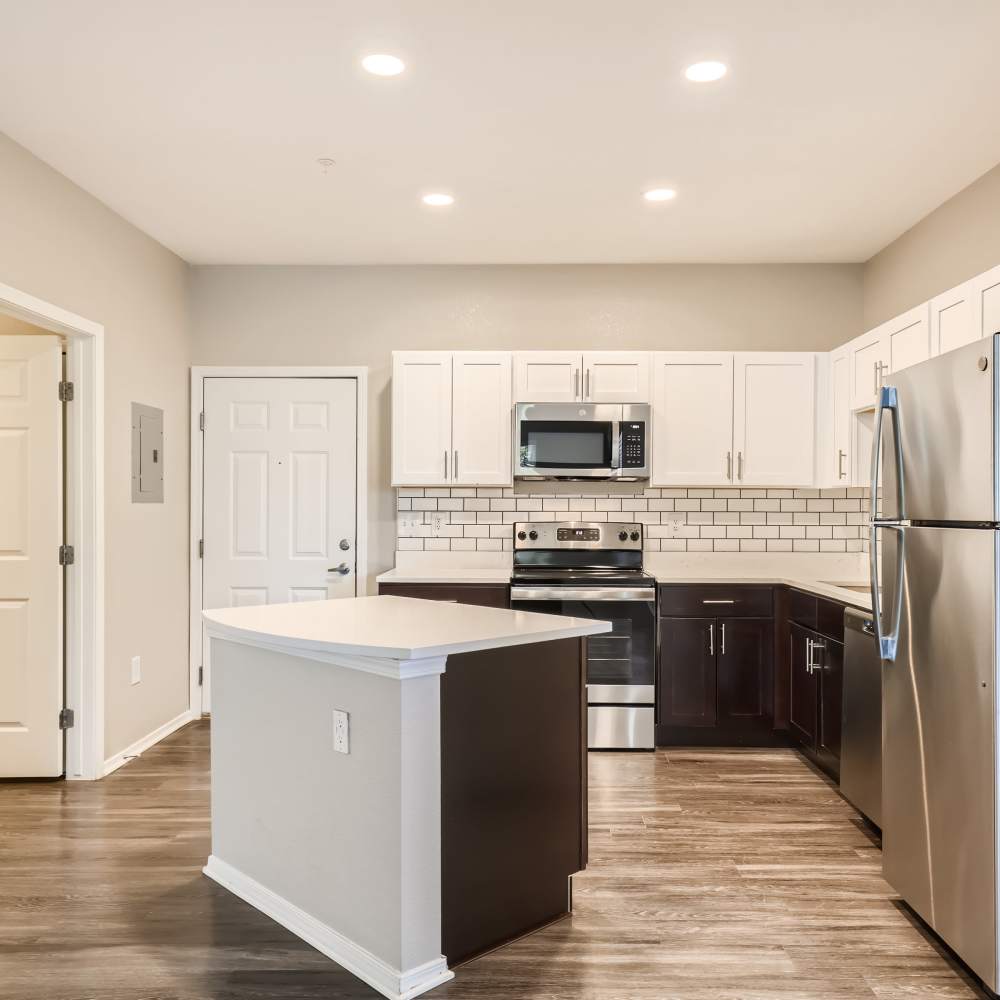 Kitchen with island at Panorama at Arvada Ridge in Arvada, Colorado