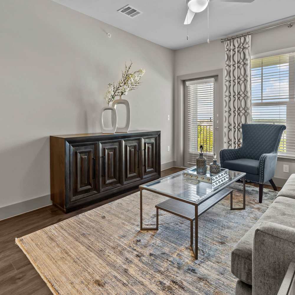 Living room with windows at Harbor Hill in Rockwall, Texas