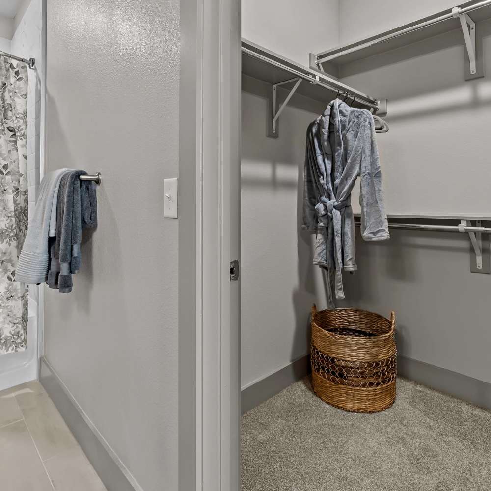 Clothes in the walk-in closet at Harbor Hill in Rockwall, Texas