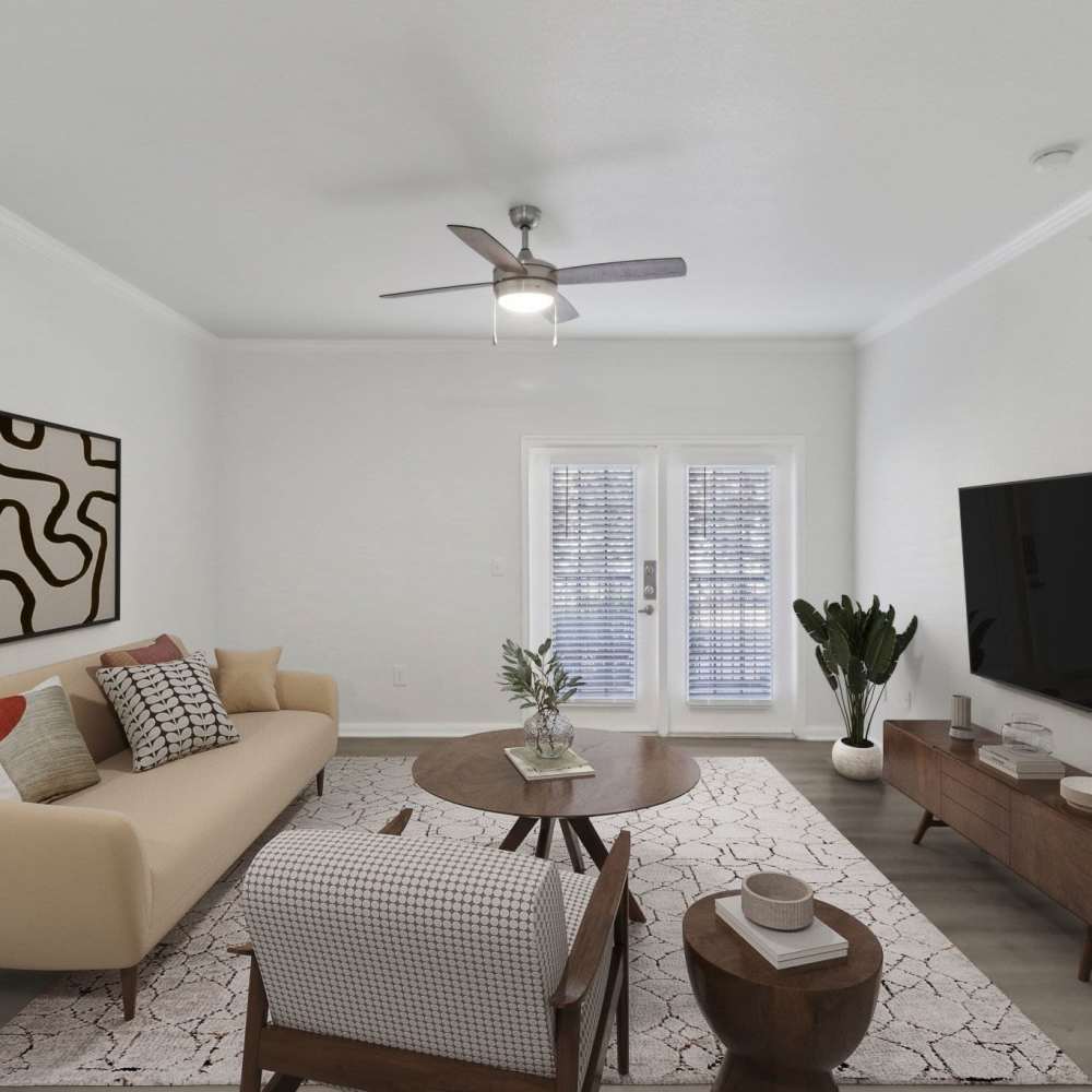Living room with attached patio at Harlan at Med Center in San Antonio, Texas 