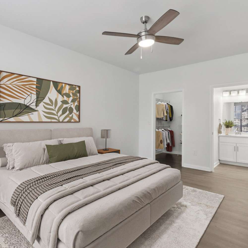 Bedroom with attached washroom at Harlan at Med Center in San Antonio, Texas 