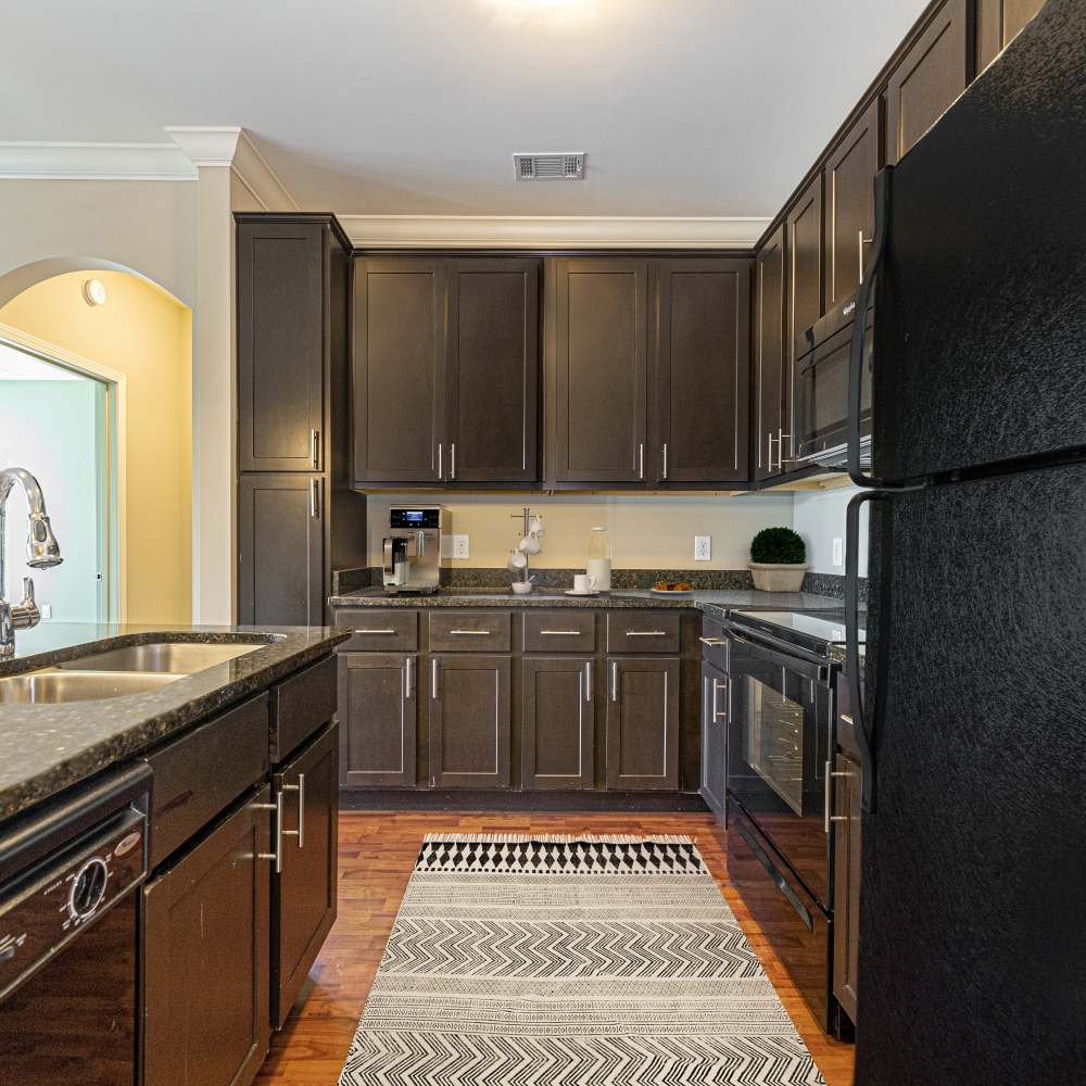 Kitchen with wooden cabinets at Boulder Springs of Columbia in Columbia,Missouri