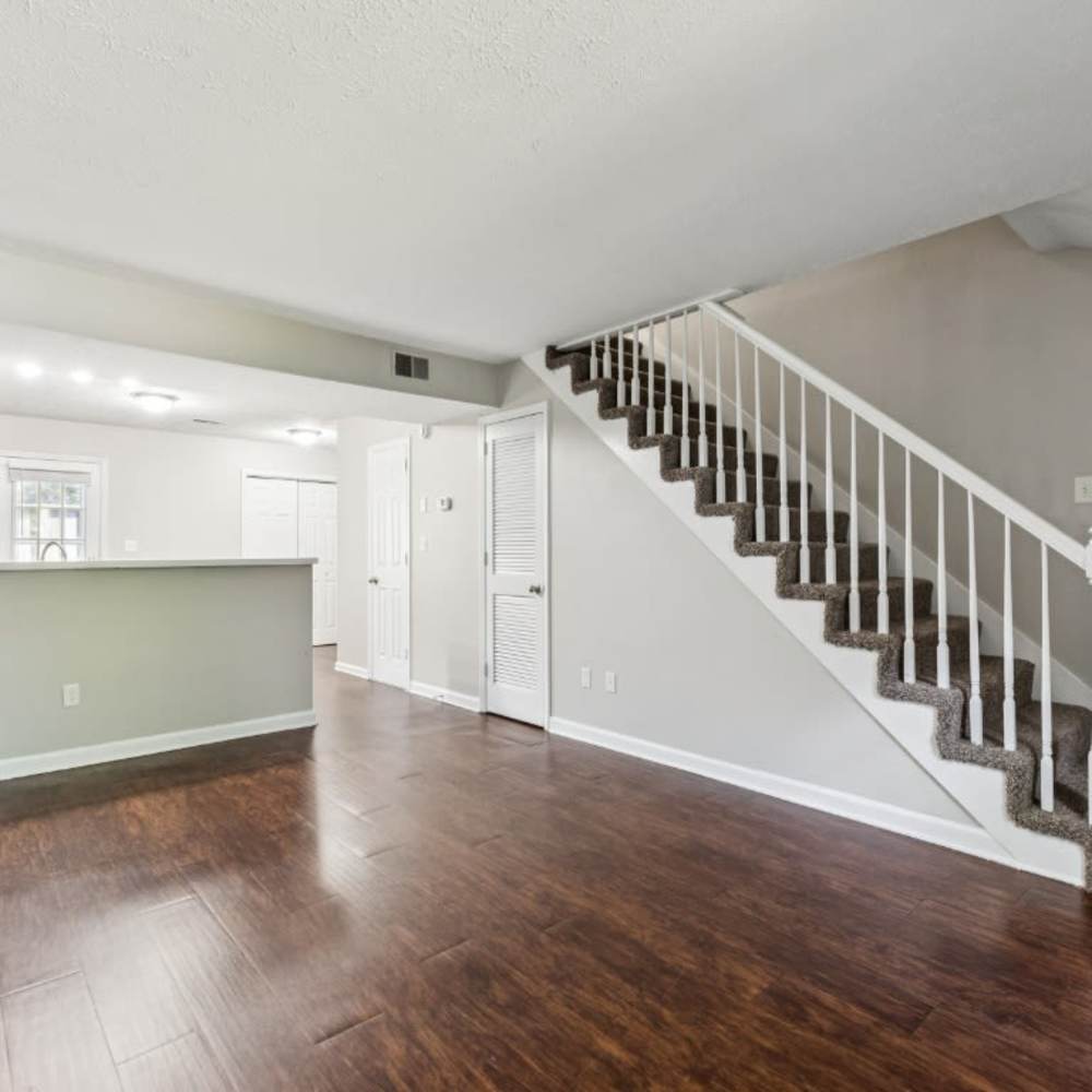 Unfurnished living room with stairs leading to the second floor at Davis Park in Smyrna, Tennessee