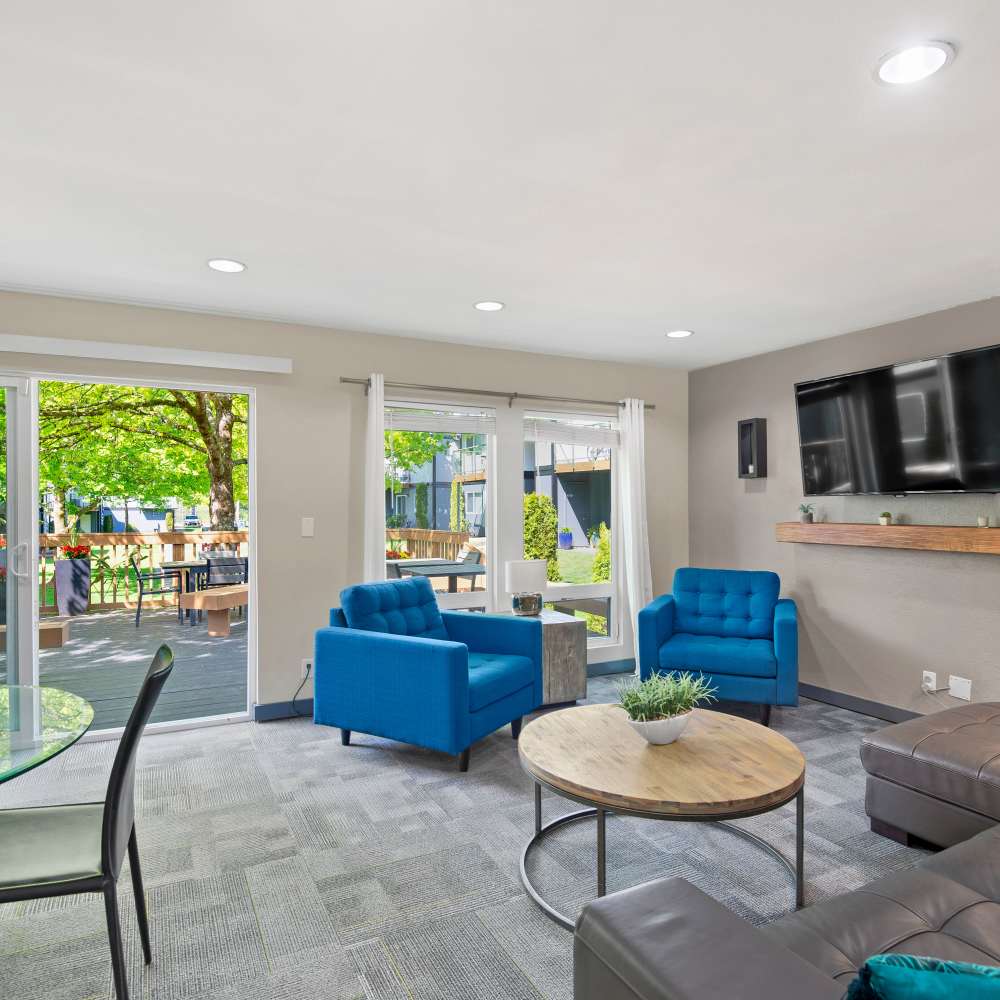 Indoor lounge with television at Tessera in Everett, Washington