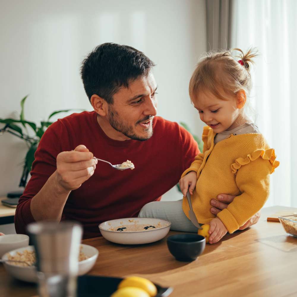 Father and daughter in the kitchen at Tristan Townhomes in Garden City, Georgia