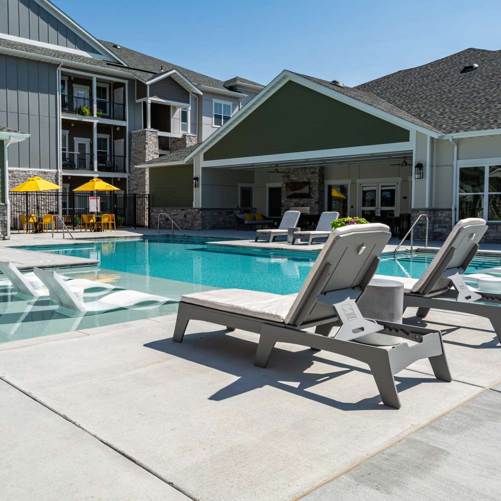 Swimming pool with lounge chairs at Citrine at Lake St. Louis in Lake Saint Louis,Missouri