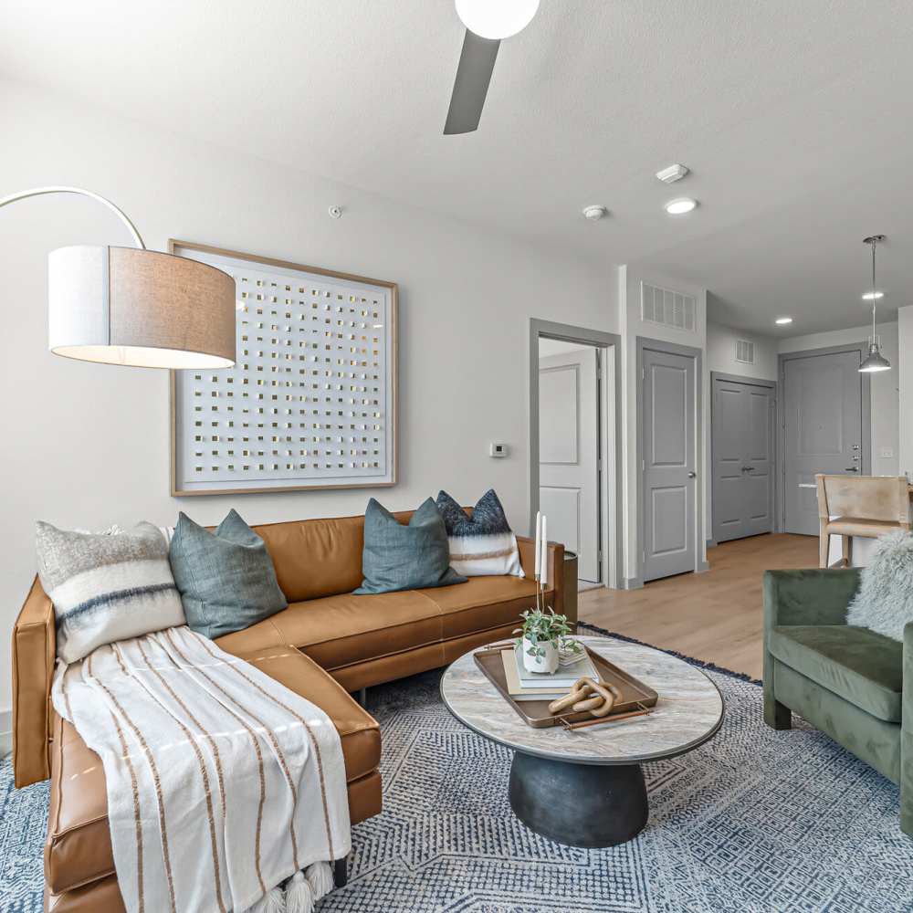 Spacious living room with sofa set at Main and Mill in Lewisville,Texas