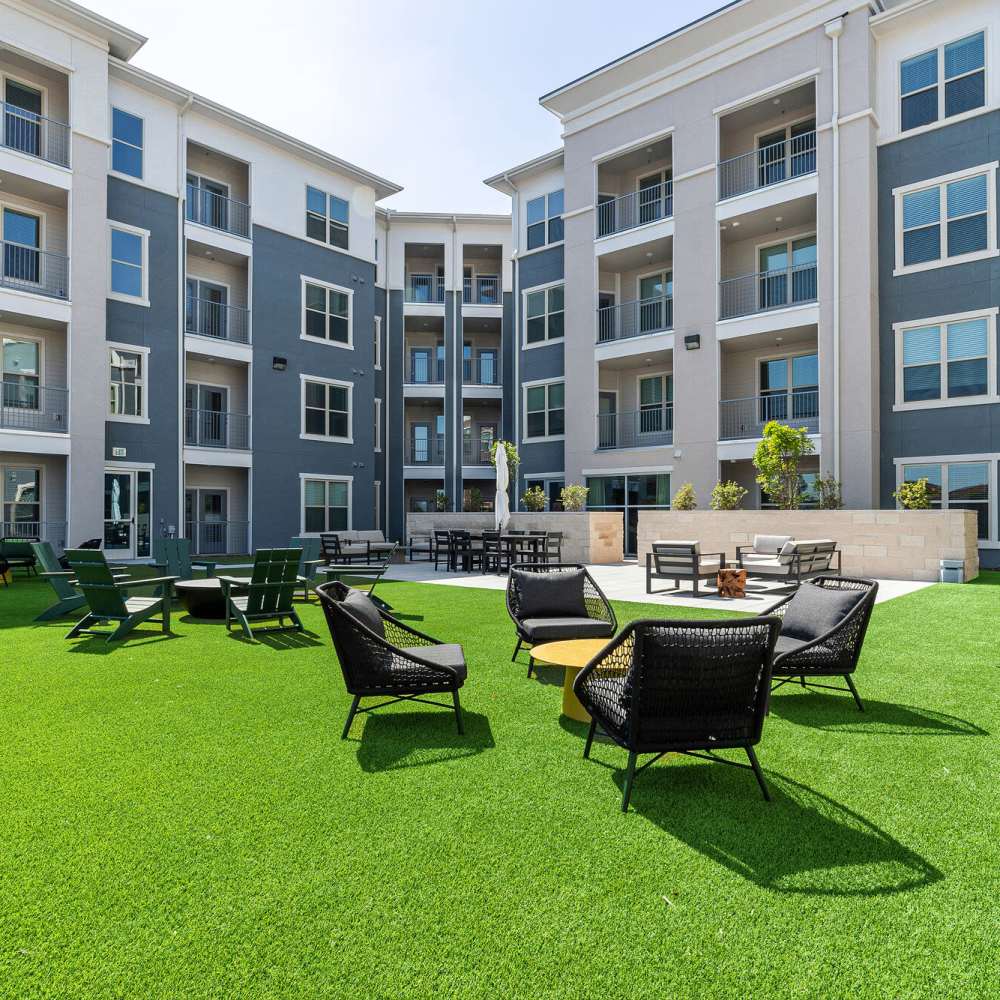 Outdoor seating with grass flooring at Main and Mill in Lewisville,Texas