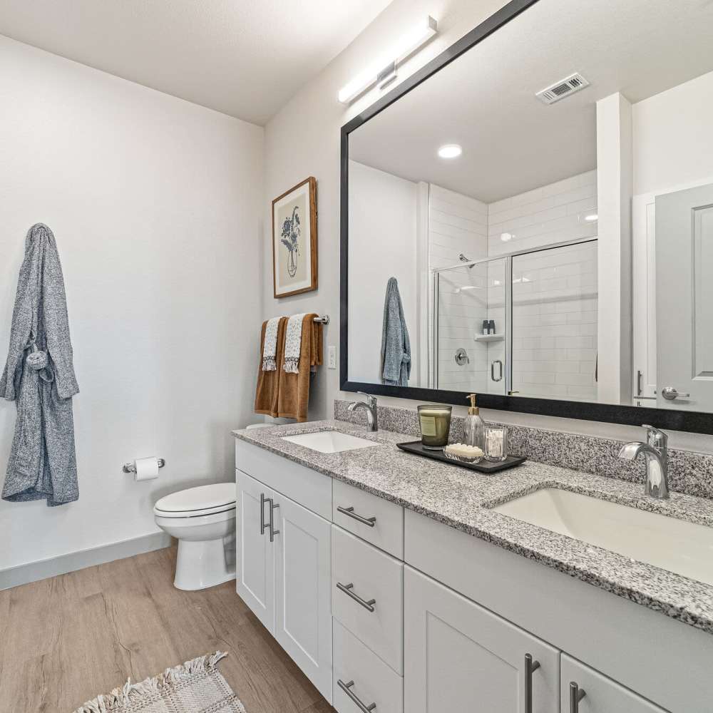 Bathroom with white vanity unit at Main and Mill in Lewisville,Texas
