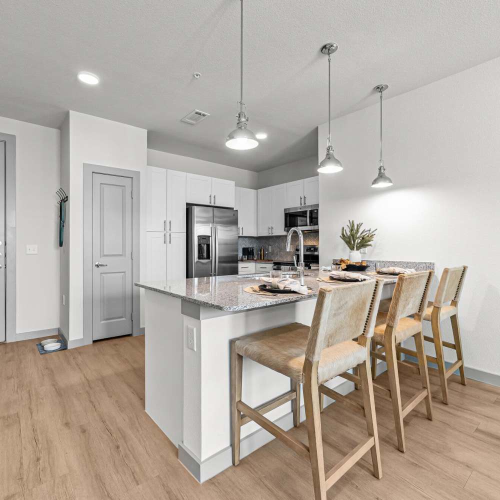 Kitchen with a breakfast counter at Main and Mill in Lewisville,Texas