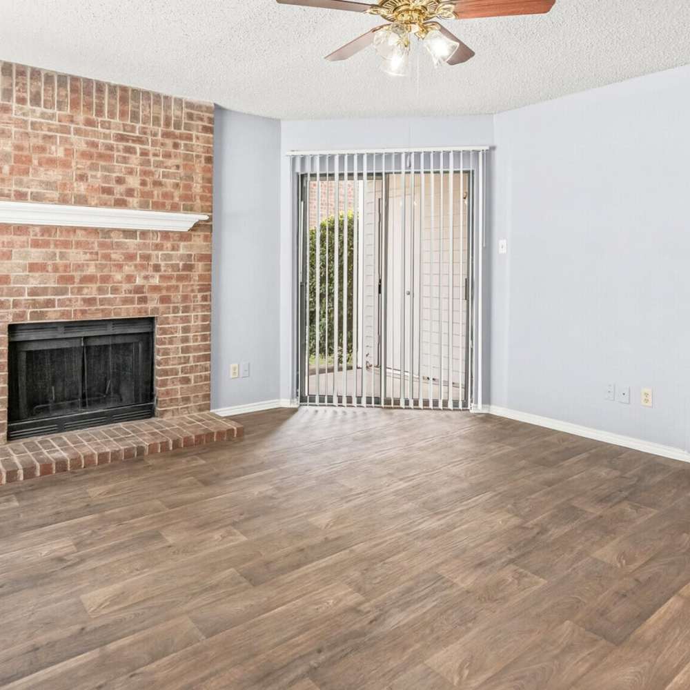 Living room with fireplace at North Hills Place in Richland Hills, Texas