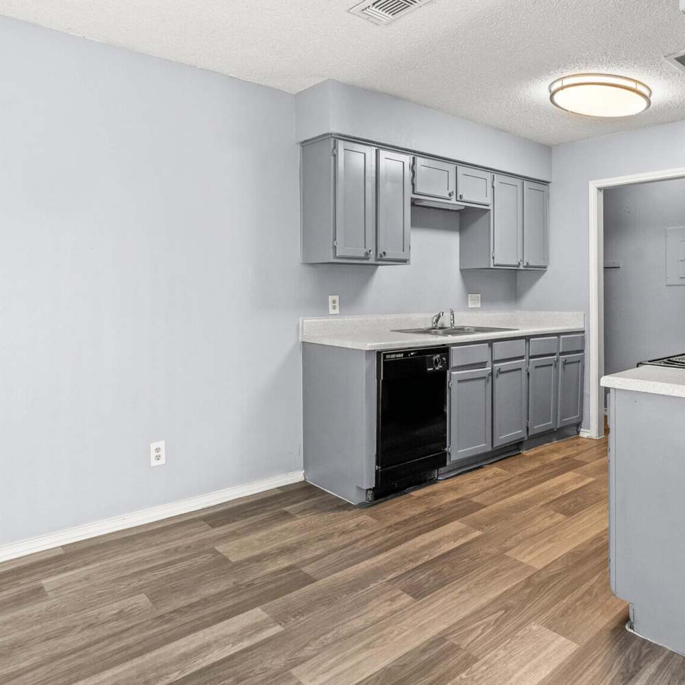Kitvhen with wood-style flooring at North Hills Place in Richland Hills, Texas