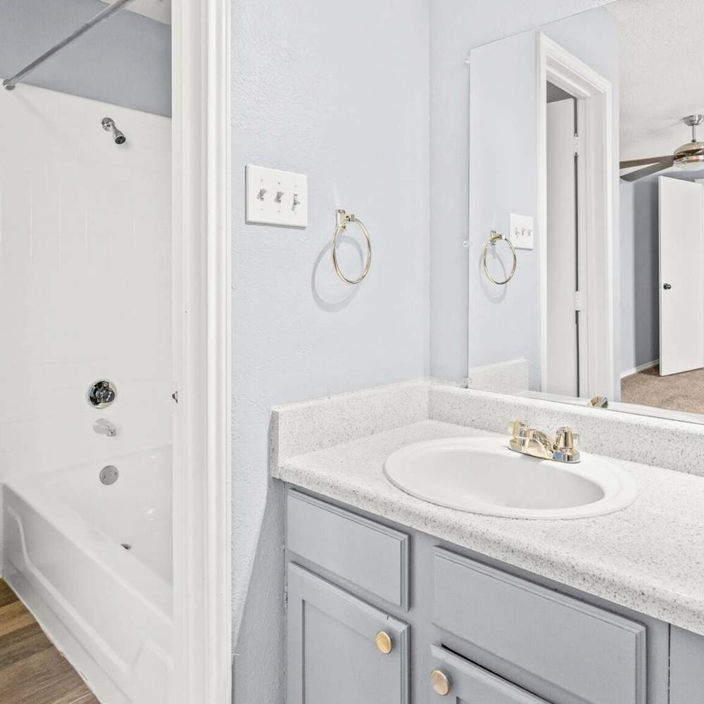 Bathroom with large mirror at North Hills Place in Richland Hills, Texas
