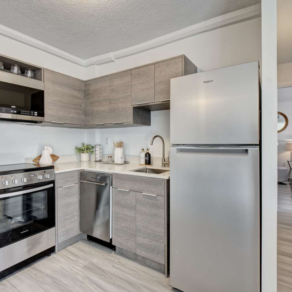 Kitchen with refrigerator at The Nora in Dallas,Texas