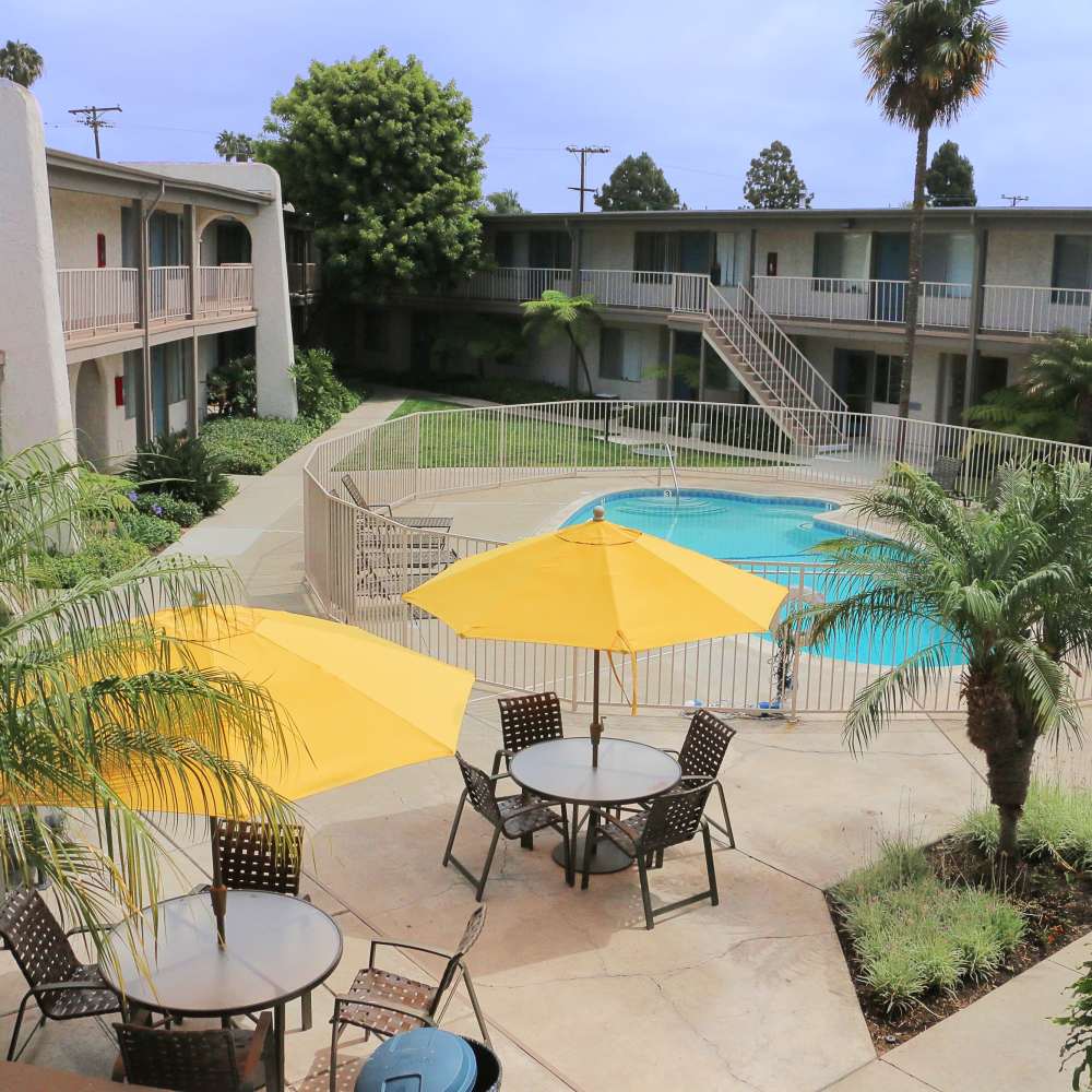 Pool with sunloungers at Sandpointe in Huntington Beach, California
