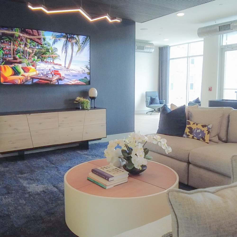 Clubhouse entertainment section with large television at Avonlea Pointe in Duluth, Georgia