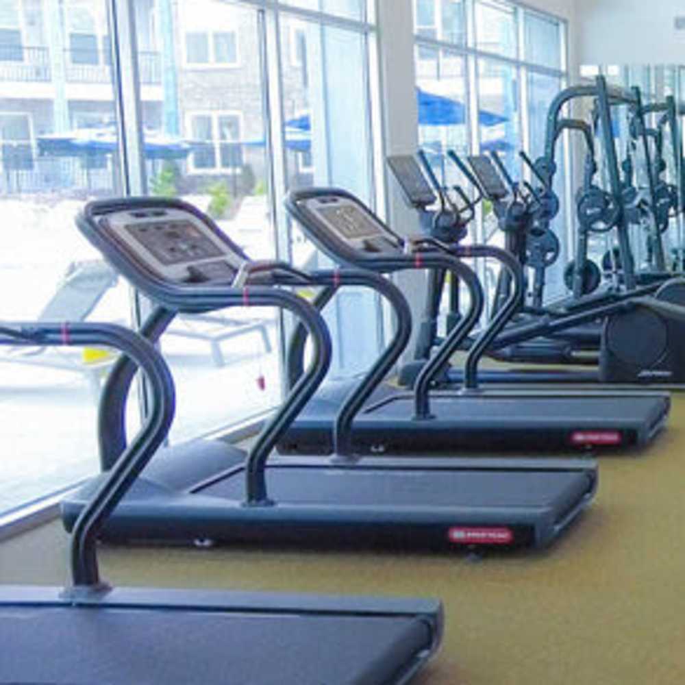 Fitness center with treadmills at Avonlea Pointe in Duluth, Georgia