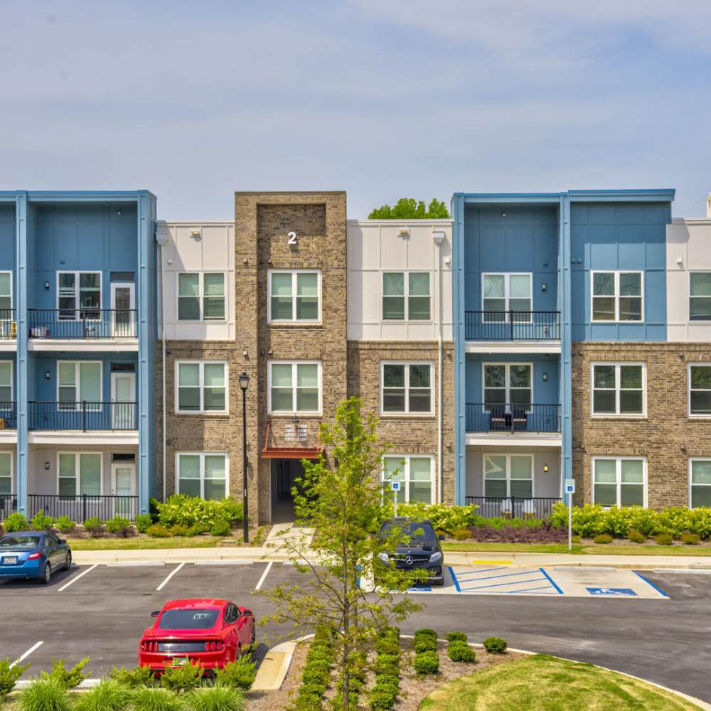 Community exterior building with parking area at Avonlea Pointe in Duluth, Georgia