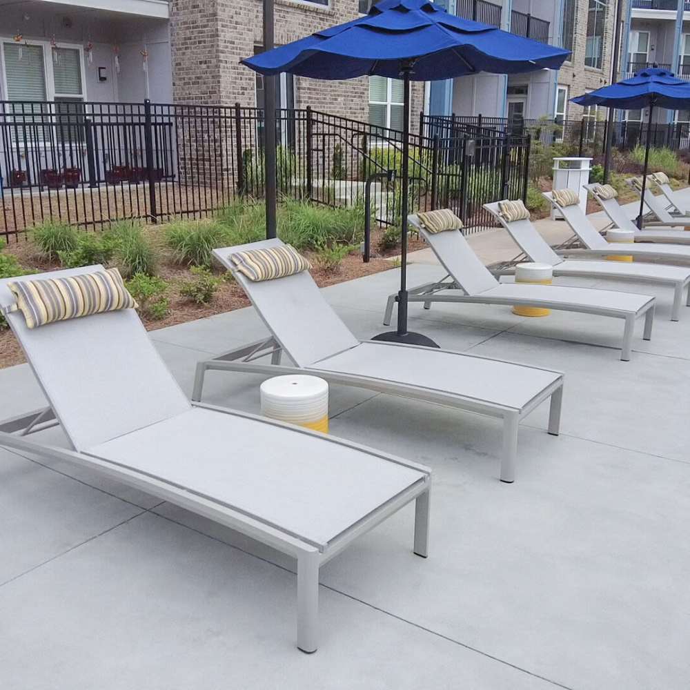 Lounge chair with umbrella at Avonlea Pointe in Duluth, Georgia