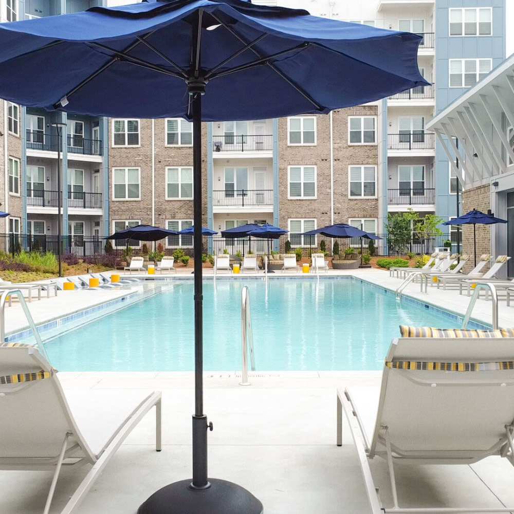 Seating area beside pool side at Avonlea Pointe in Duluth, Georgia