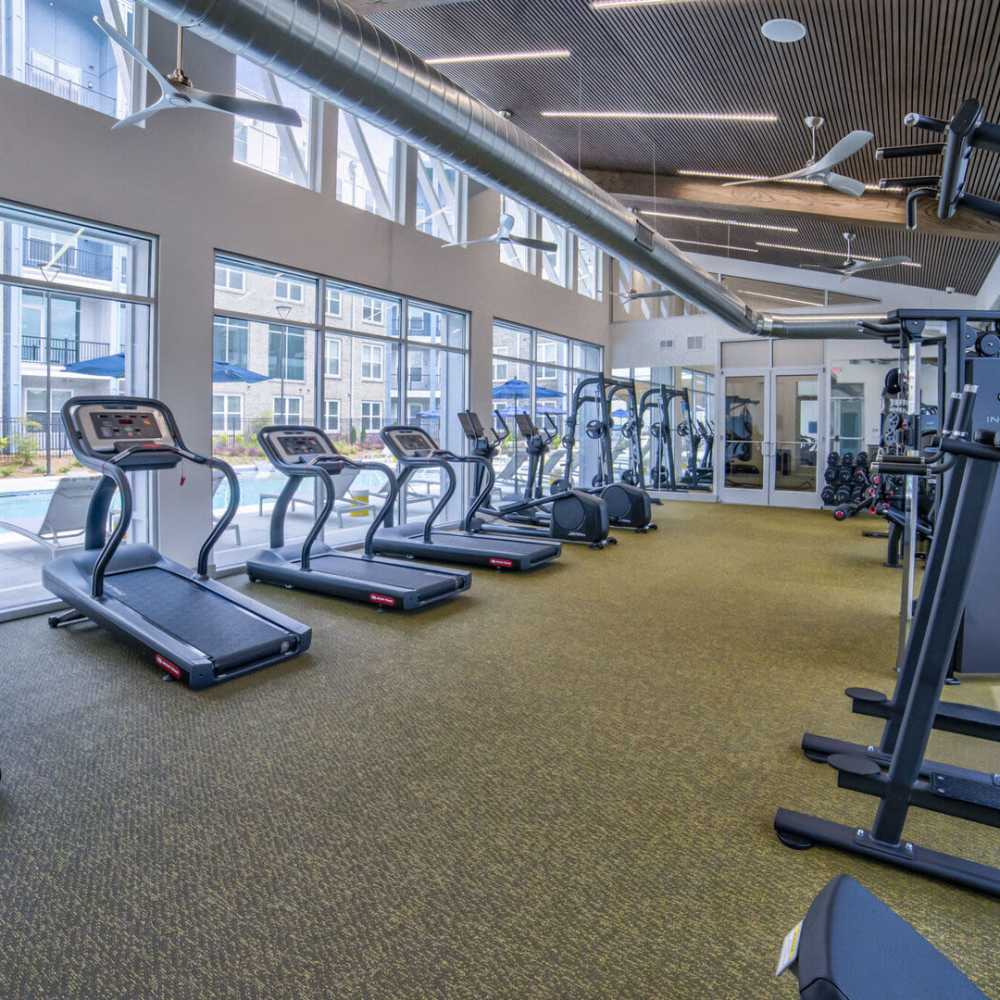 Fitness center with with double height window at Avonlea Pointe in Duluth, Georgia
