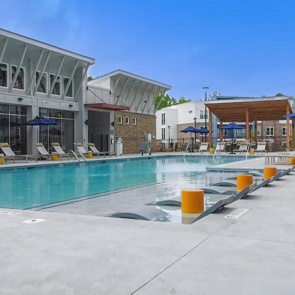 Swimming pool with lounge chair at Avonlea Pointe in Duluth, Georgia