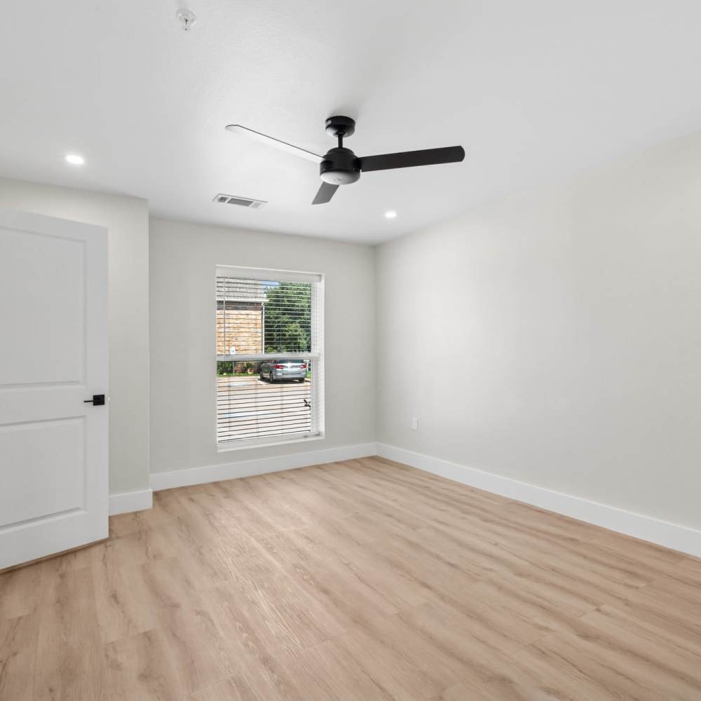 Bedroom with a ceiling fan at Lake Meadows in Garland, Texas
