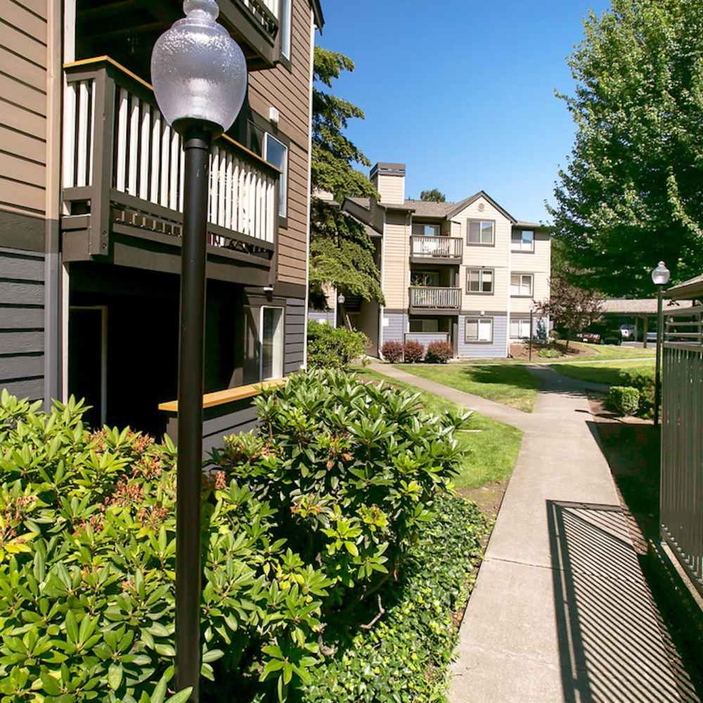 Exterior of community with walking paths at Plum Tree Park in Renton, Washington