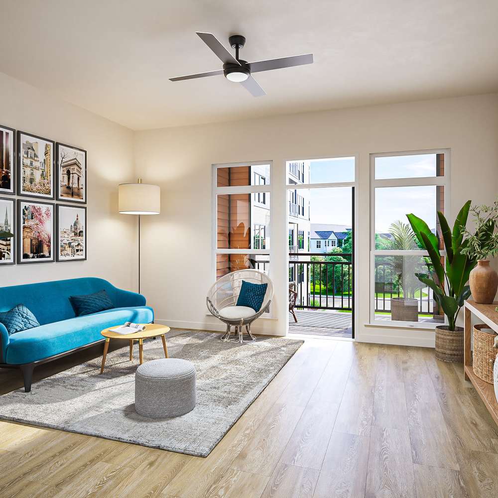 Living room with wood-style flooring and access to private balcony at Neo Vantage Point in Maryland Heights, Missouri