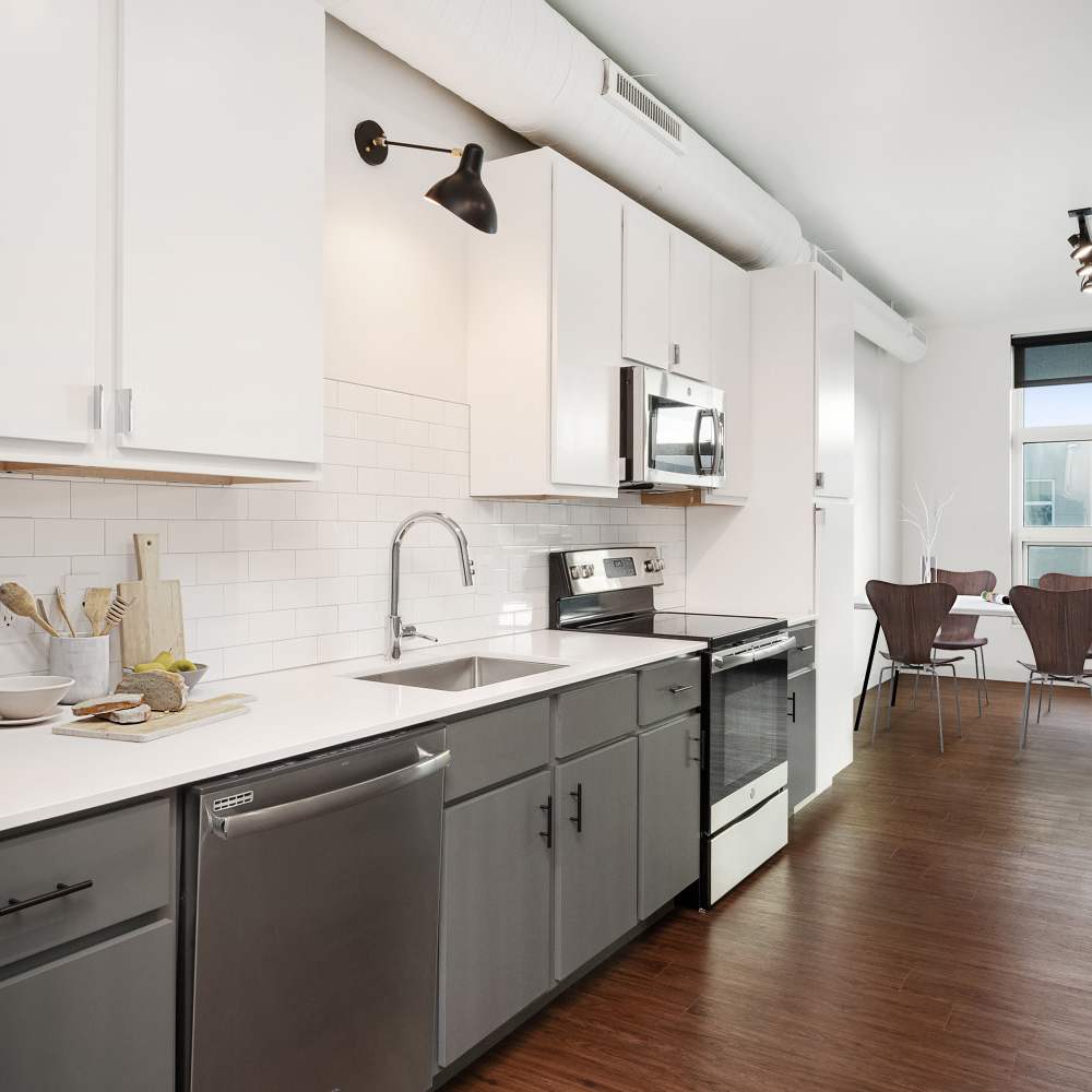 Upgraded kitchen with modern appliances and sleek cabinetry at Metropolitan Flats in Saint Louis, Missouri