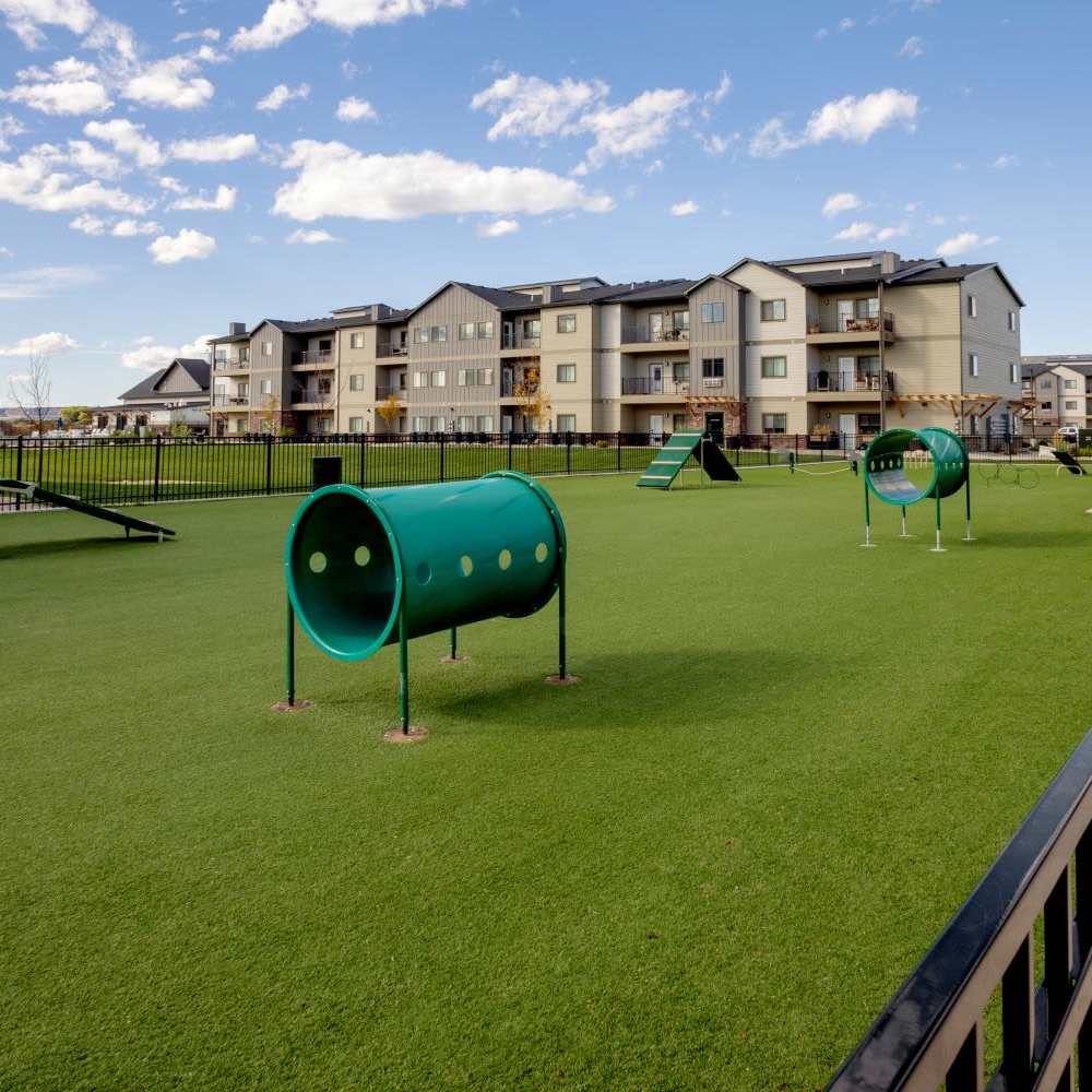 View of the building and the dog park at InterUrban Apartments in Billings, Montana