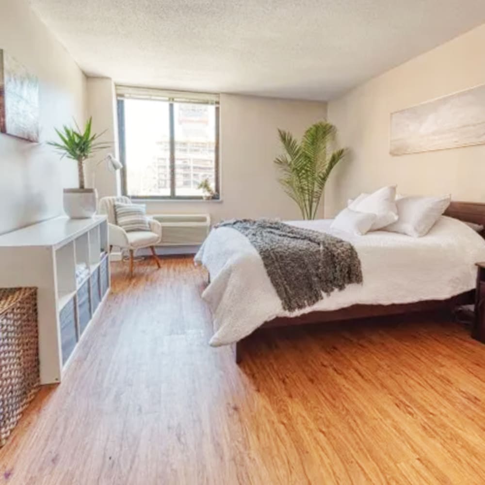 Bedroom with wood-style flooring at Del Coronado Apartments in St. Louis, MissouriDel Coronado Apartments in St. Louis,Missouri