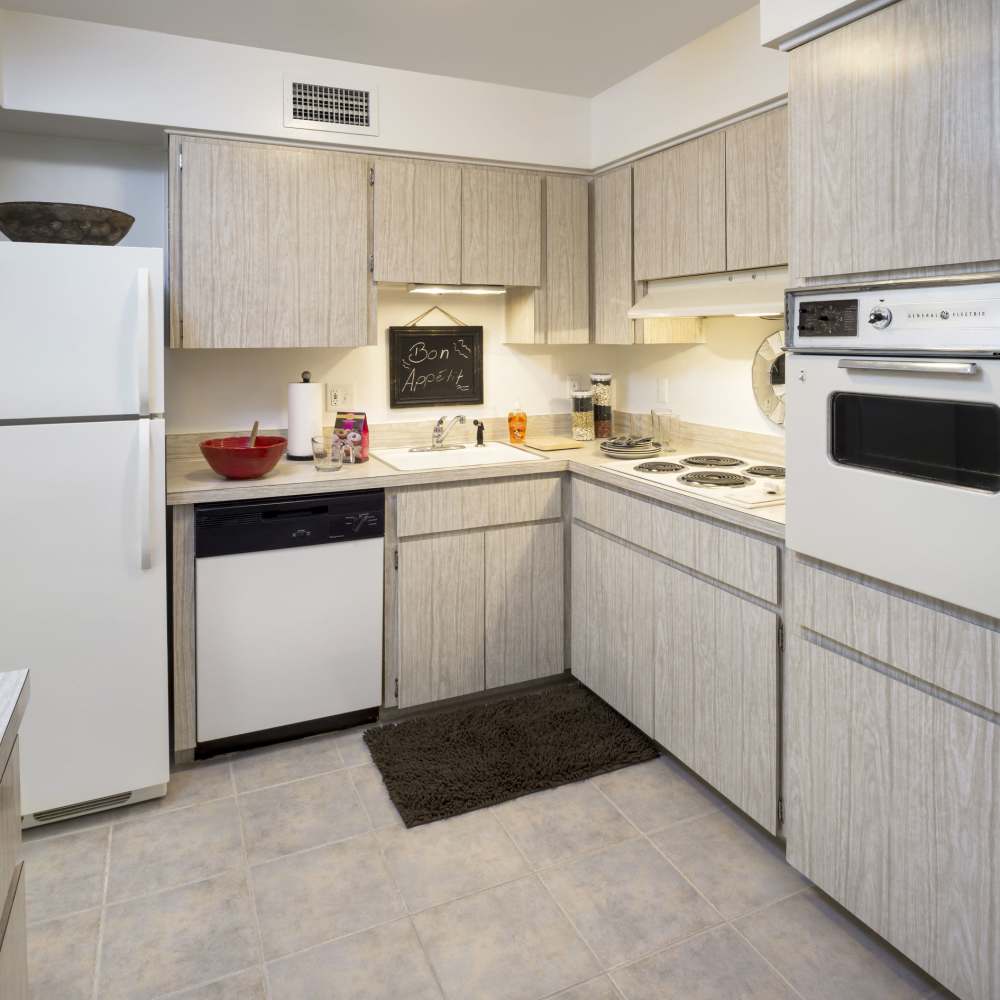 Kitchen with white cabinets at Lake Lucerne Towers in Orlando,Florida