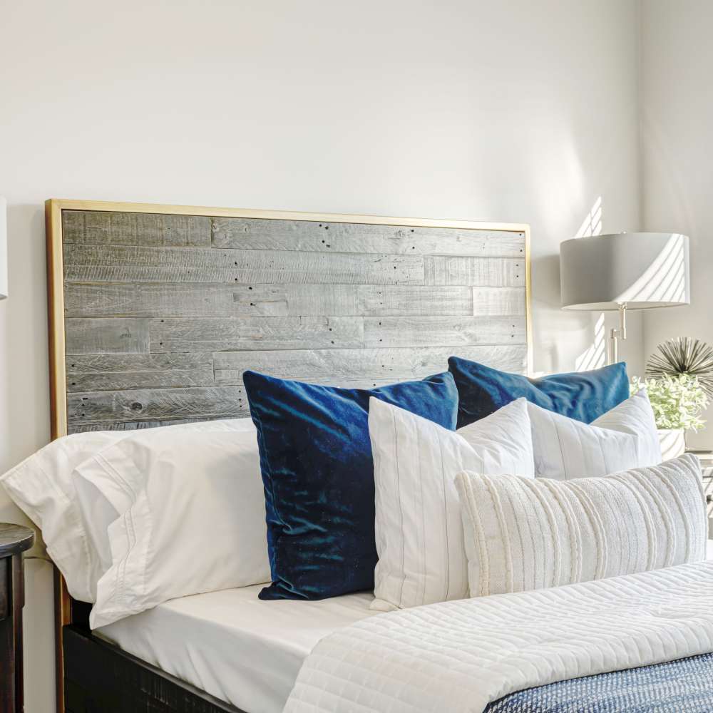 Cozy bedroom with wood headboard at 7 at Seven Mile Creek in Nashville, Tennessee