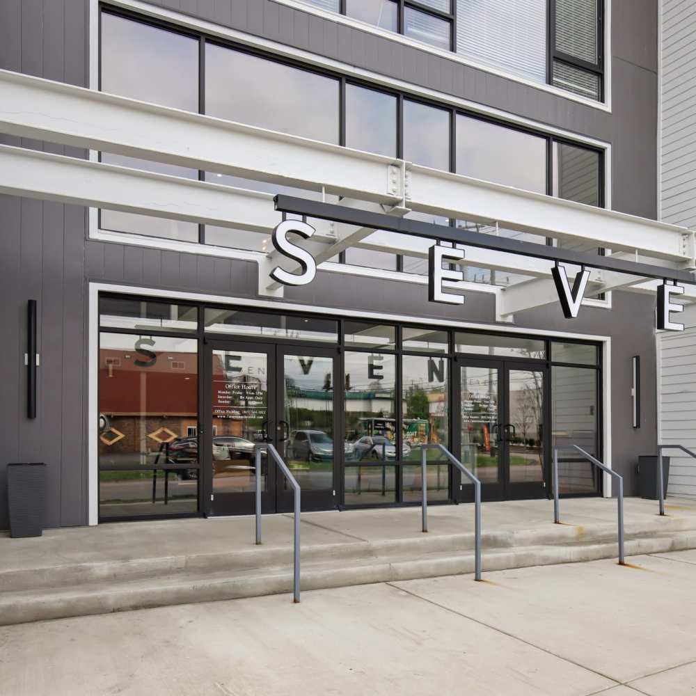 Glass entryway with signage at 7 at Seven Mile Creek in Nashville, Tennessee