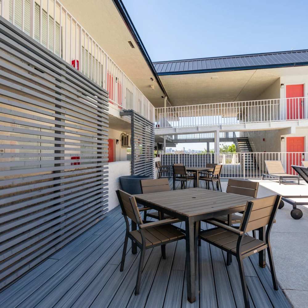 Outdoor seating area near poolside at Sohana Apartments in Nashville, Tennessee