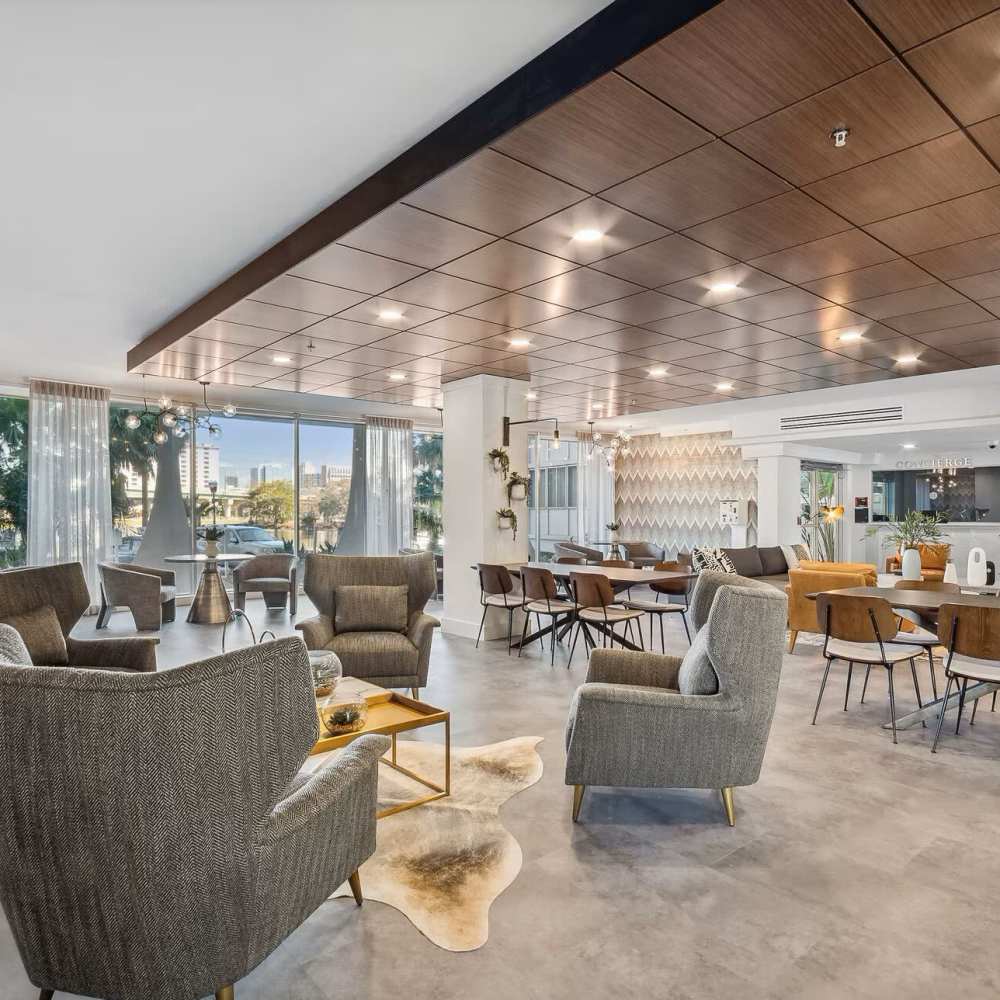 Hardwood-style flooring in the well-furnished living area of an apartment home a