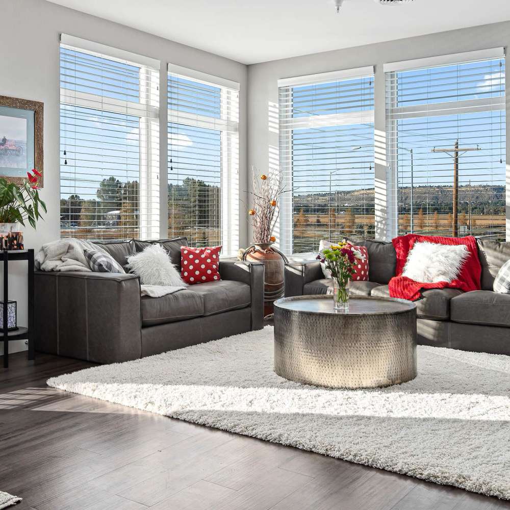Living room with full height window at Shiloh Commons in Billings, Montana