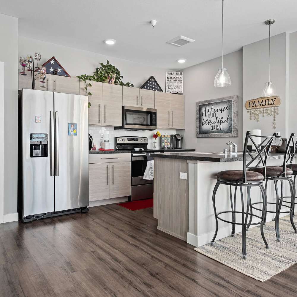 Kitchen with side by side refrigerator at Shiloh Commons in Billings, Montana