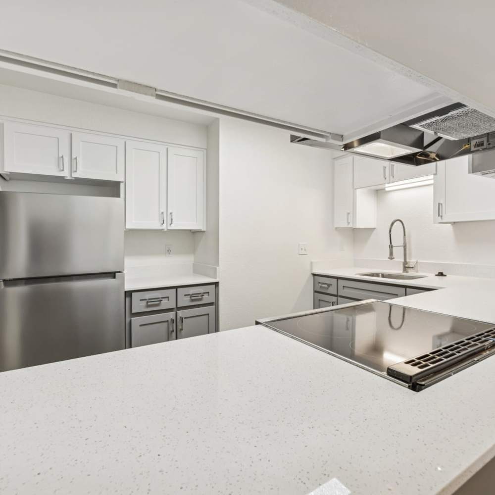 kitchen with white counters and stainless steel appliances