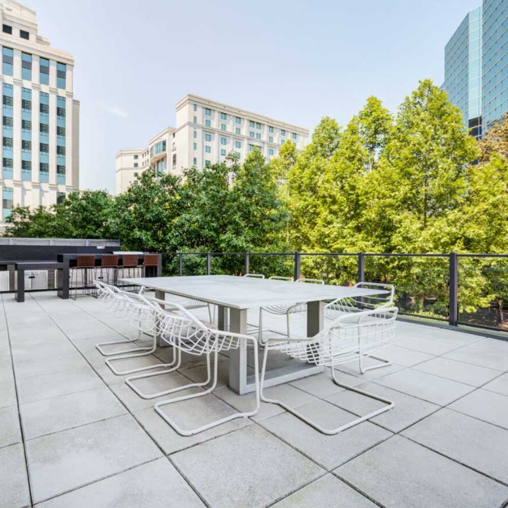 Outdoor seating with greenery around at Tellus in Arlington, Virginia
