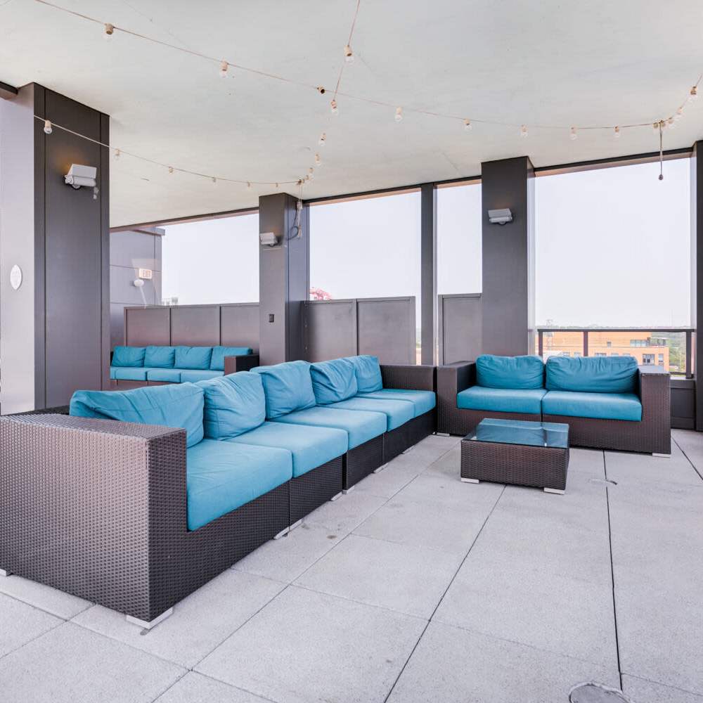 Covered seating area by the swimming pool at Tellus in Arlington, Virginia