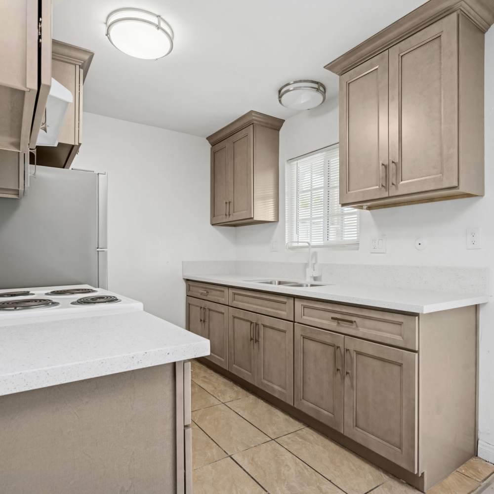 View of kitchen with window at Newland Garden Apartments in Garden Grove, California