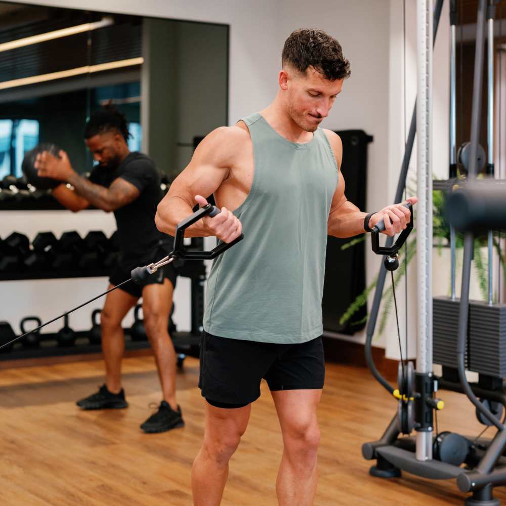 Resident working out in the fitness center at Green|House Columbus in Columbus, Ohio