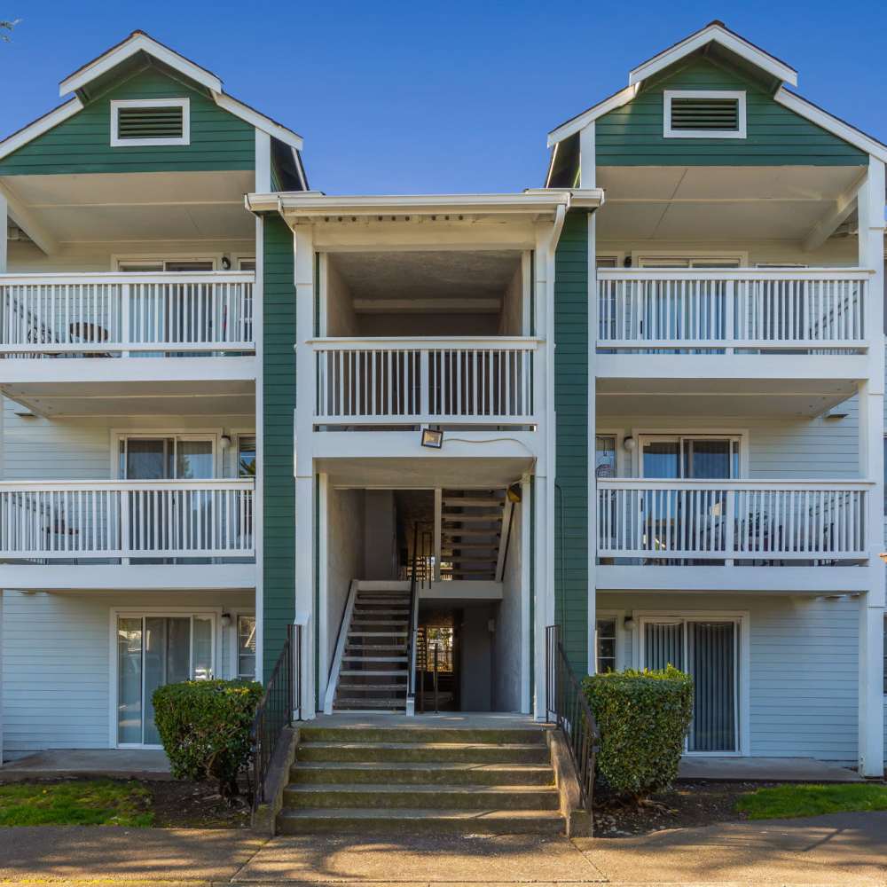 Indoor swimming pool featuring comfortable lounge seating for relaxation at Terravista in Tacoma, Washington