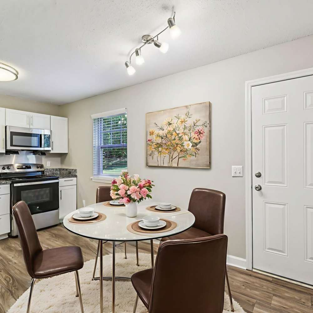 Dining area with three-seater dining table at The Ashley in Columbia,Tennessee
